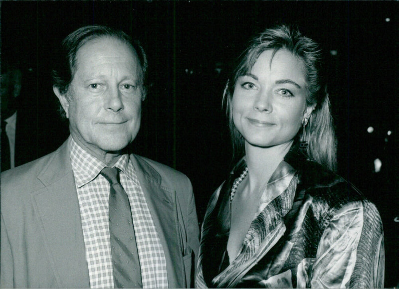 British film director Nic Roeg and his wife, American actress Theresa Russell, pose for the camera. Russell starred in the 1987 film "Black Widow". - Vintage Photograph