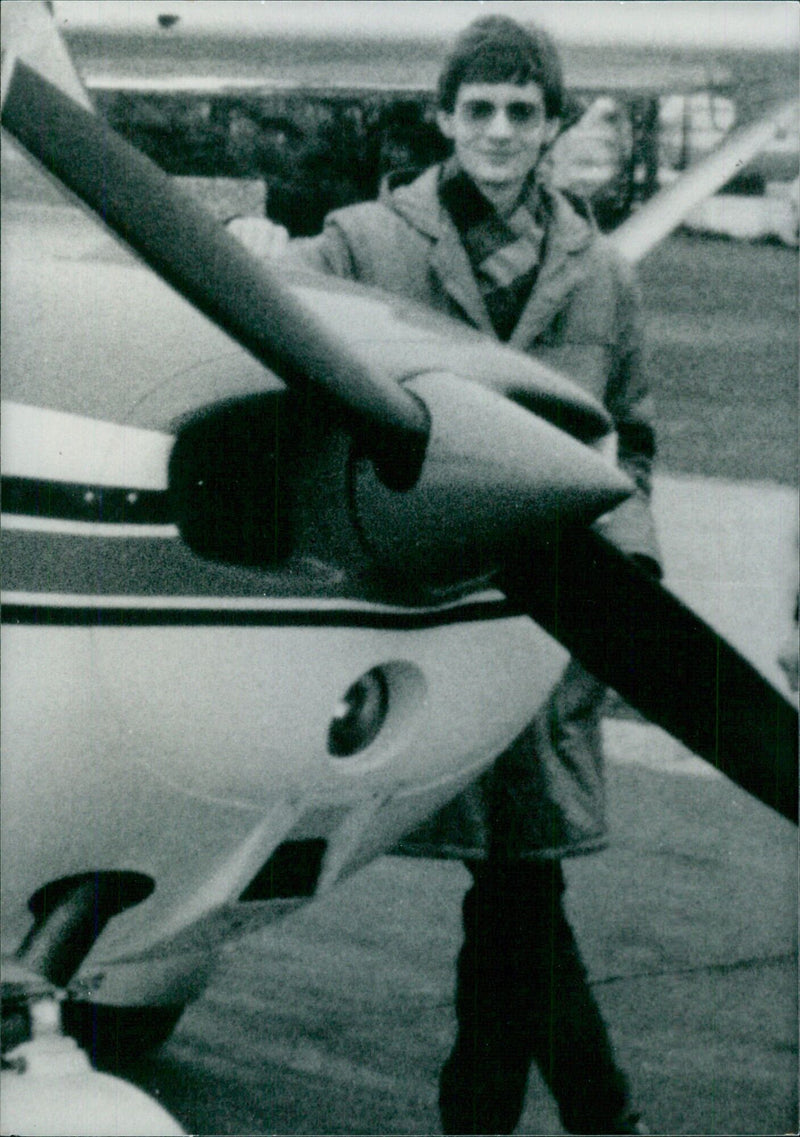 German pilot Mathias Rust is seen here with his Cessna light aircraft, which he flew 600 miles across heavily guarded Soviet territory in 1987, buzzing Lenin's mausoleum and landing within 100 yards of the Kremlin. - Vintage Photograph