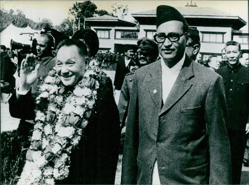 Vice-Premier Teng Hsiao-ping is warmly welcomed with flowers upon his arrival in Katmandu for an official visit to Nepal. - Vintage Photograph