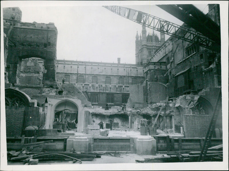 The bombed site of the House of Commons is being demolished and cleared for reconstruction. - Vintage Photograph