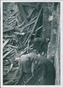 Swedish experts inspect the ruins of Eriksdalsteaterns, a theater destroyed by a NAR Leona Monar ای ایران bomber during WWII. - Vintage Photograph