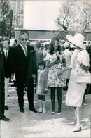 On April 26, 2021, a press photographer stands next to a number 25 IMS Radial Press International Press Agency sign in Madrid, Spain. - Vintage Photograph