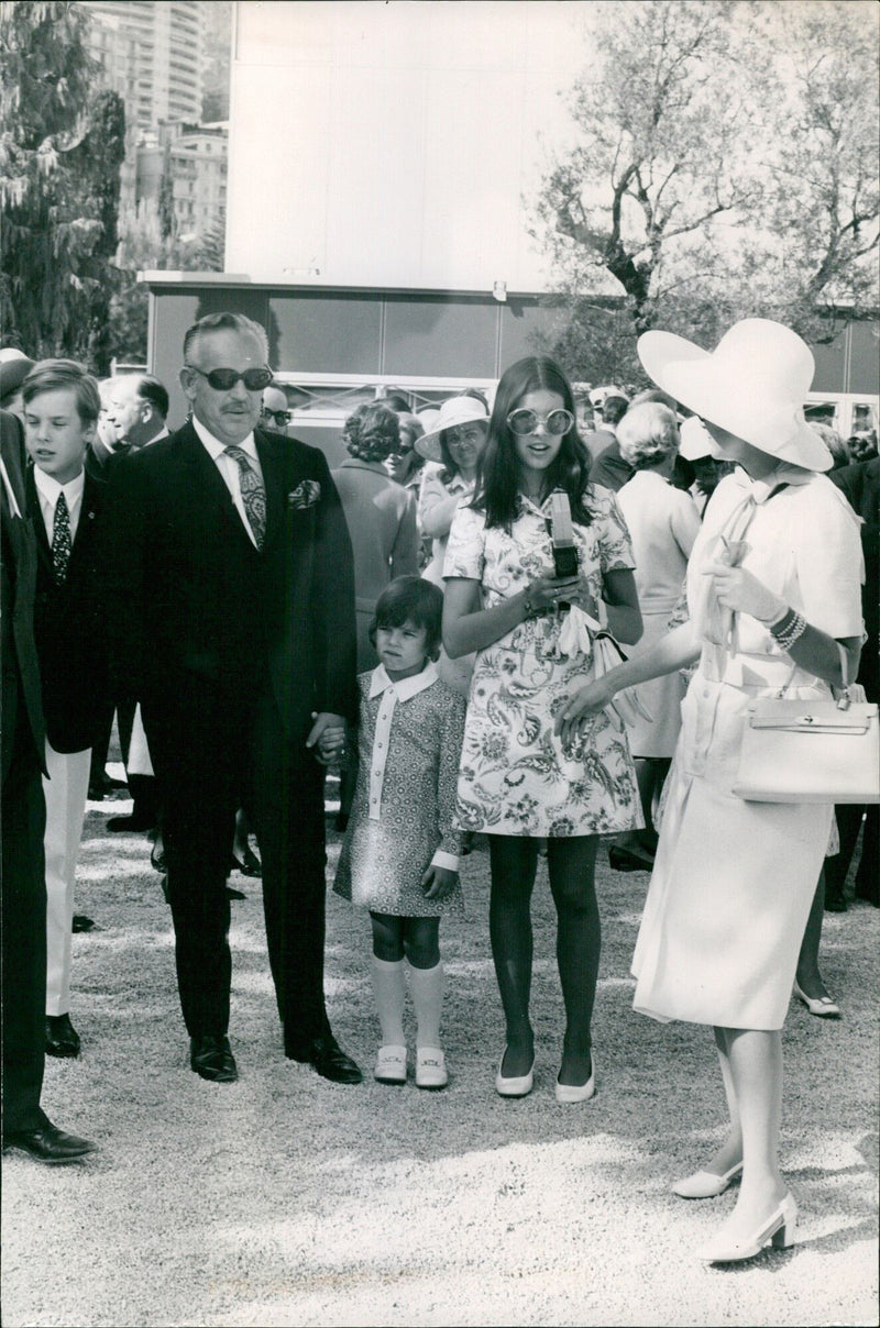 On April 26, 2021, a press photographer stands next to a number 25 IMS Radial Press International Press Agency sign in Madrid, Spain. - Vintage Photograph
