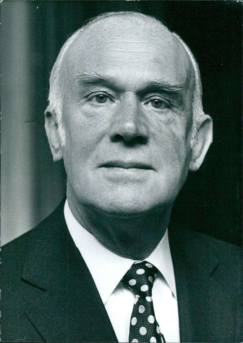 Sir Don Ryder, Chairman and Chief Executive of Reed International Ltd., poses for a portrait in London on July 25, 1985. - Vintage Photograph