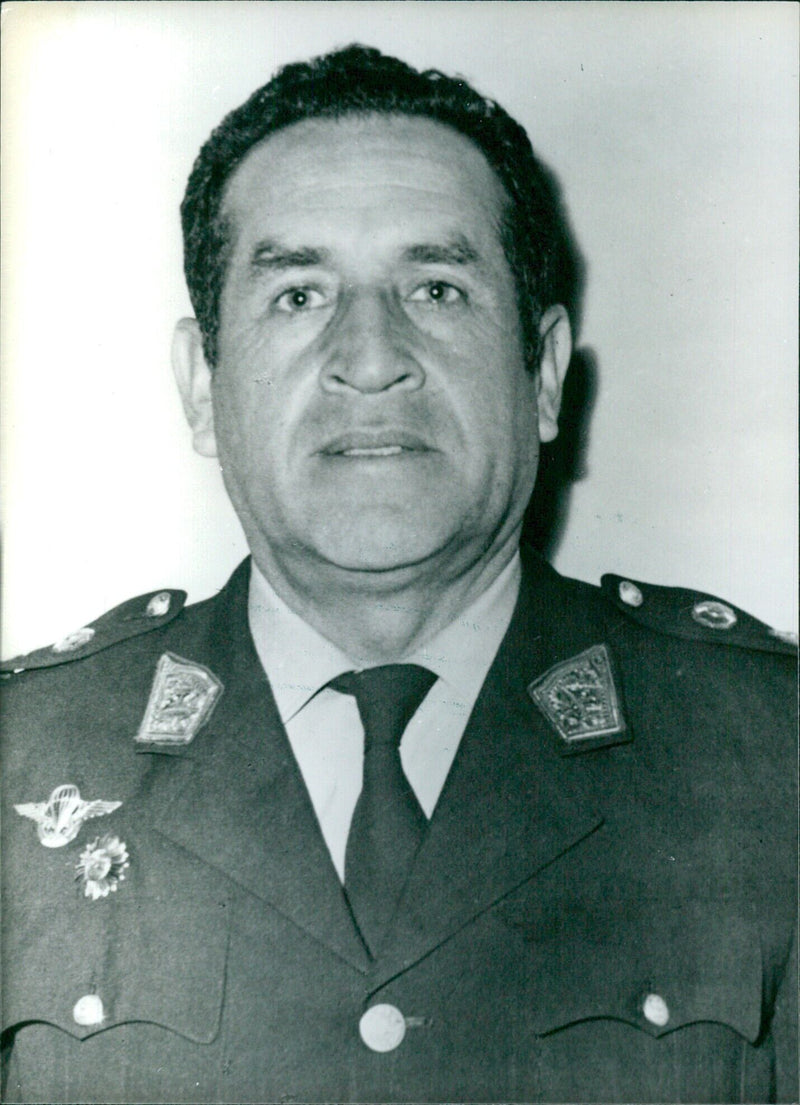 General Rafael Hoyos Rubio, formerly Minister of Food and now a prominent military man in Peru, stands with other military personnel in a 1978 photo taken by Camera Press in London. - Vintage Photograph
