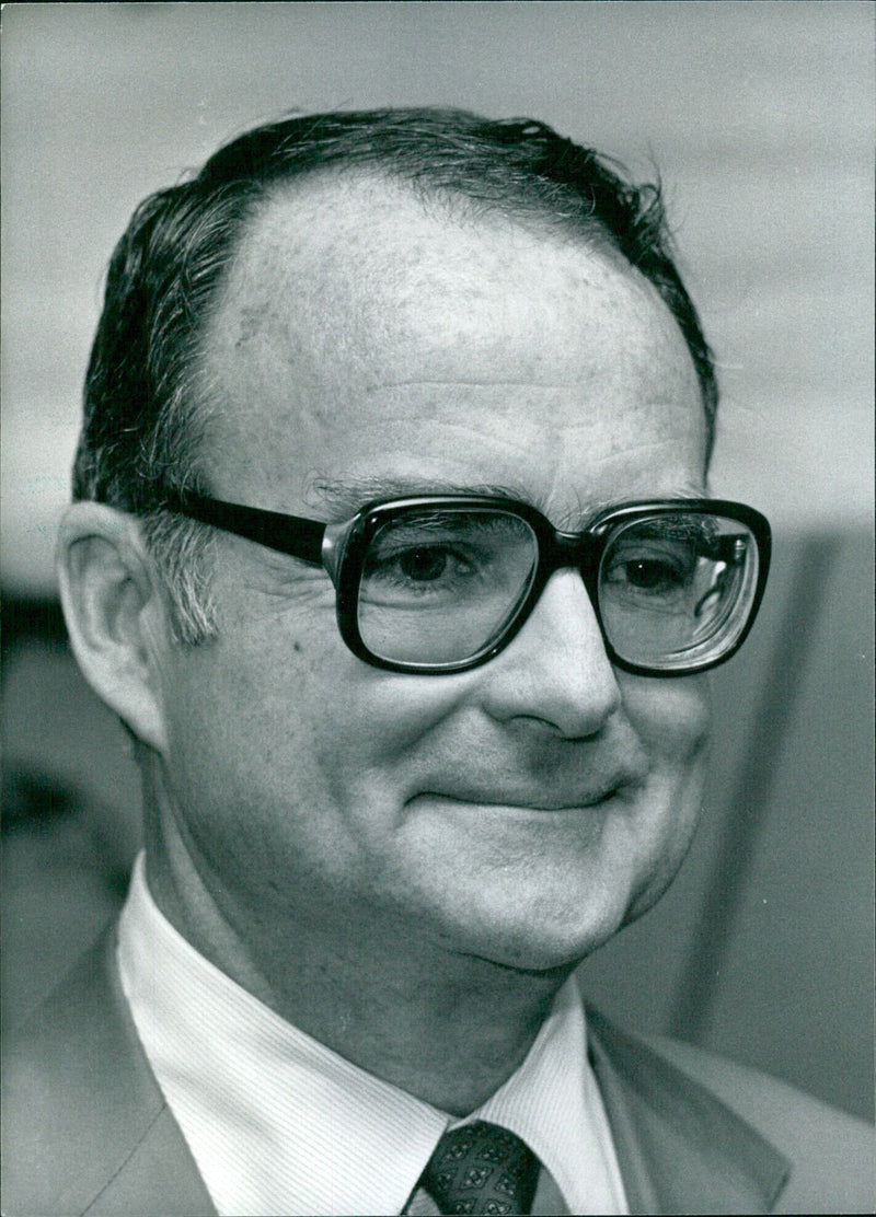 U.S. Government Officials, led by William D. Ruckelshaus, Director of the Environmental Protection Agency, gather for a meeting in 1983. - Vintage Photograph