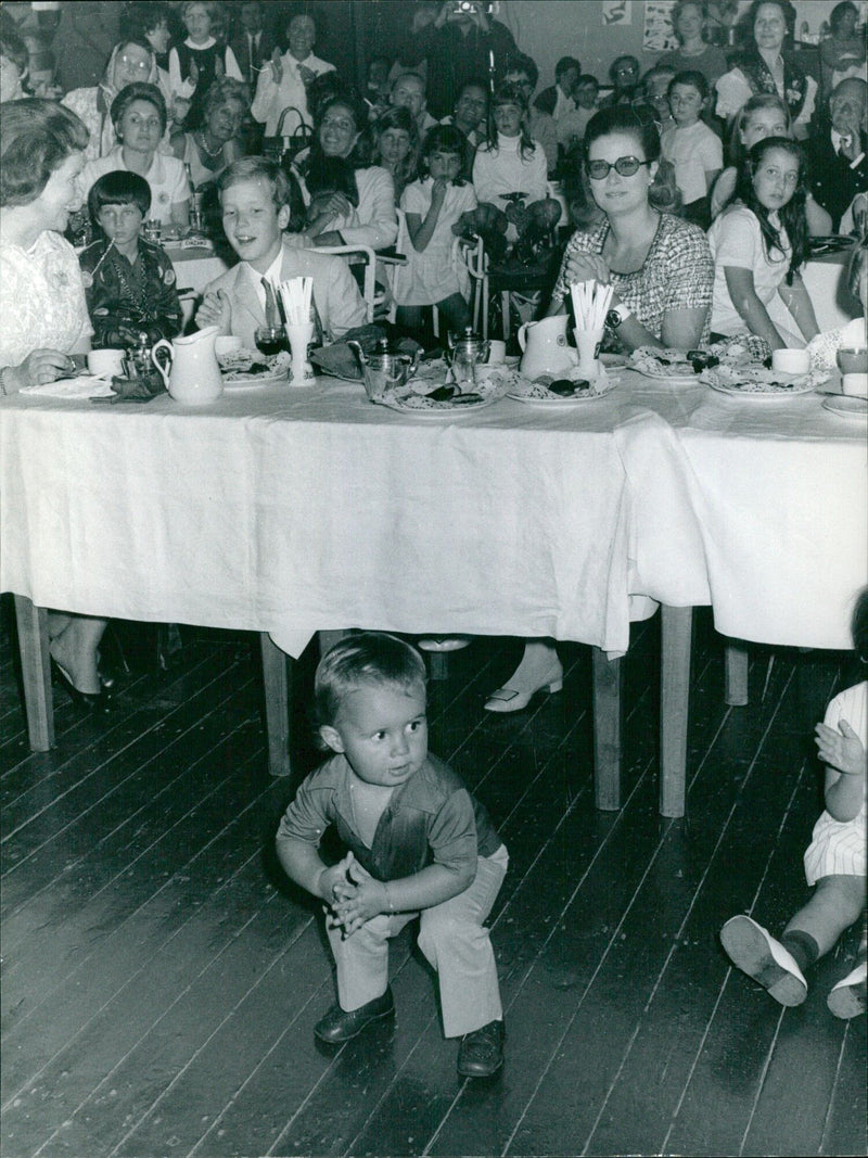 At an expo in Monte Carlo in June 1969, a young boy steals the show by showing his behind to Princess Grace as a form of protest. - Vintage Photograph