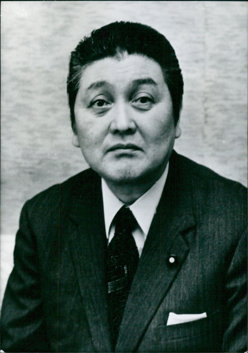 Ten Japanese politicians of the Land Agency, led by Kichiro Tazawa, meet in Tokyo to discuss policy decisions. - Vintage Photograph