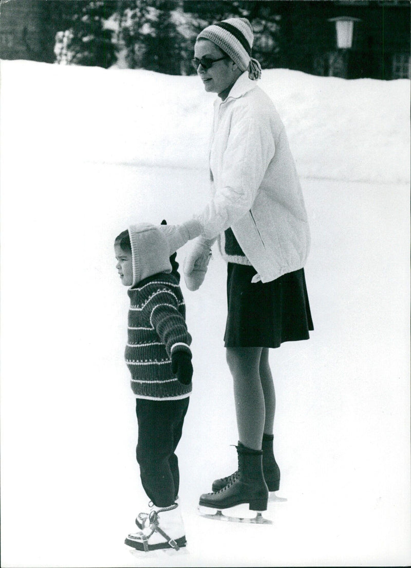 Princess Grace of Monaco lovingly watches over her daughter Princess Stephanie while on holiday in Gstaad, Switzerland, in December 1969. - Vintage Photograph