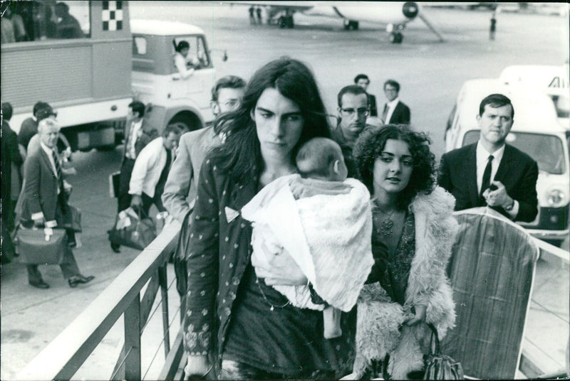 A group of people gathered in front of the Al Agenzia Fotografica Internazionale in Stockholm, Sweden on November 1, 1971. - Vintage Photograph