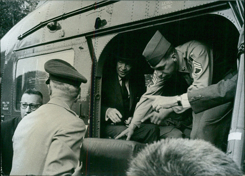 President Dwight Eisenhower departs Rambouillet Castle in France via helicopter to attend the European Council meeting in Stockholm, Sweden. - Vintage Photograph