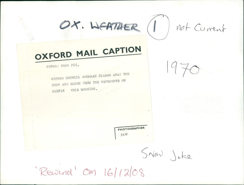 Oxford Council workman clears away snow and slush from the pavement. - Vintage Photograph