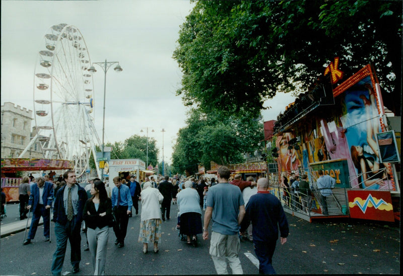 Two young girls and a grandmother enjoy the sights and attractions of Oxford St Giles Fair. - Vintage Photograph