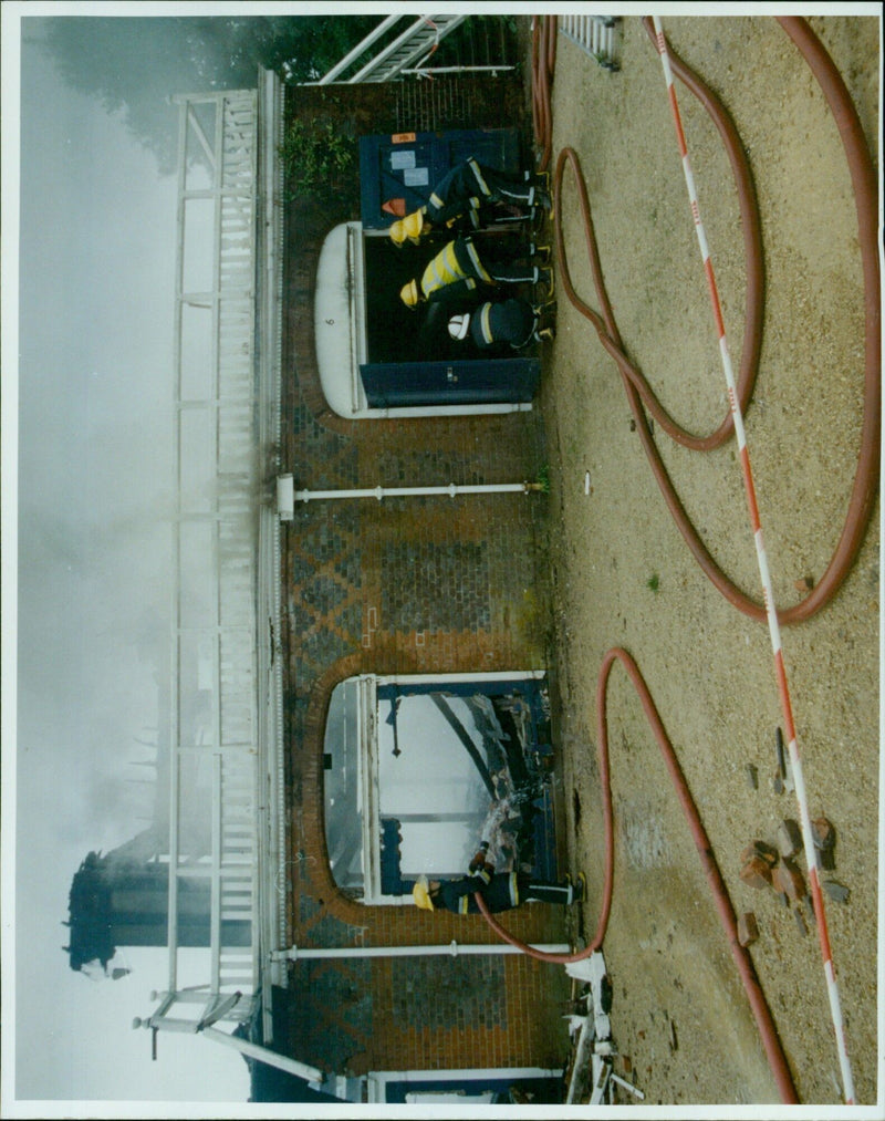 Fire crews work to extinguish a fire at Oxford University Boathouse. - Vintage Photograph