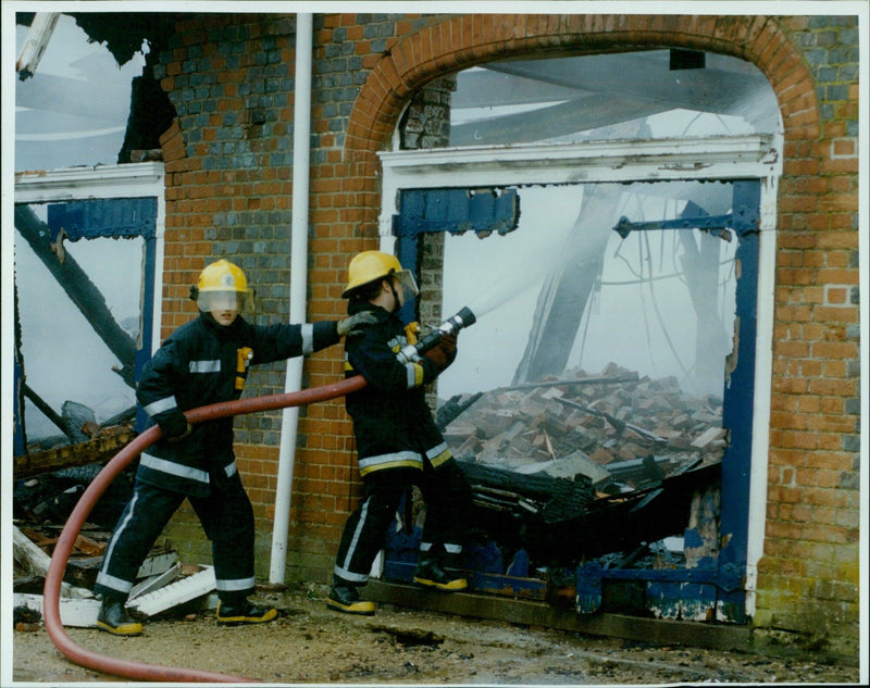 Fire crews continue to work to contain a fire at an Oxford University Boathouse. - Vintage Photograph