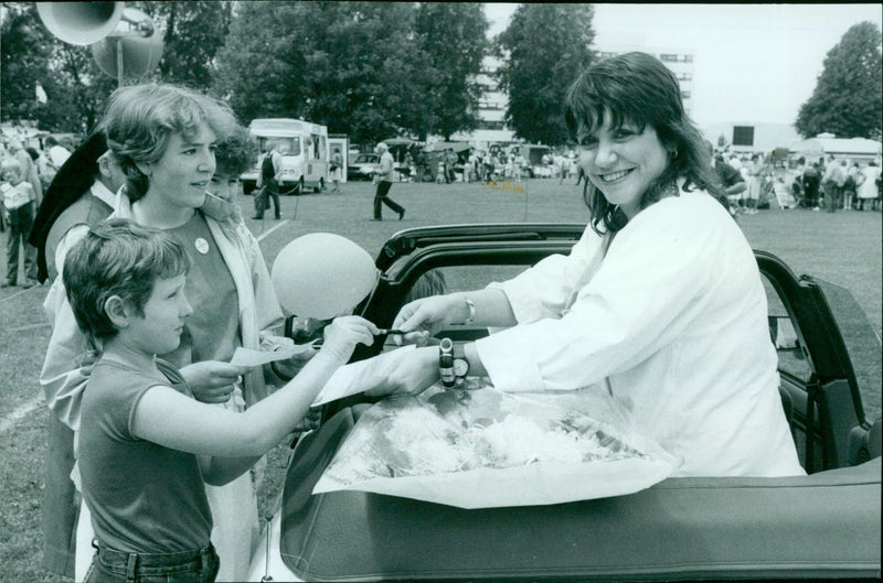 Joanna Monro signs an autograph for Nichola Walker at Radio Cherwell Fete. - Vintage Photograph