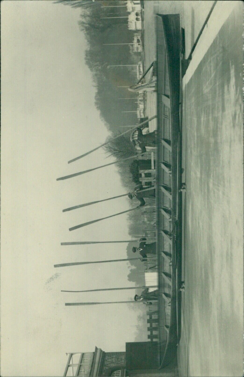 Students of Oxford University rowing in a traditional wooden boat. - Vintage Photograph