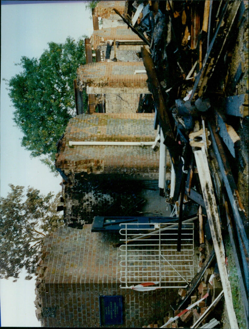 The burnt-out wreckage of the University College Boathouse in Oxford after a fire. - Vintage Photograph