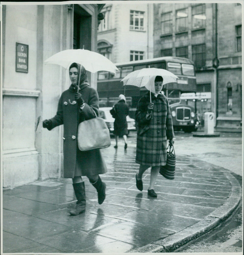 People braving the windy winter weather in Oxford, UK. - Vintage Photograph