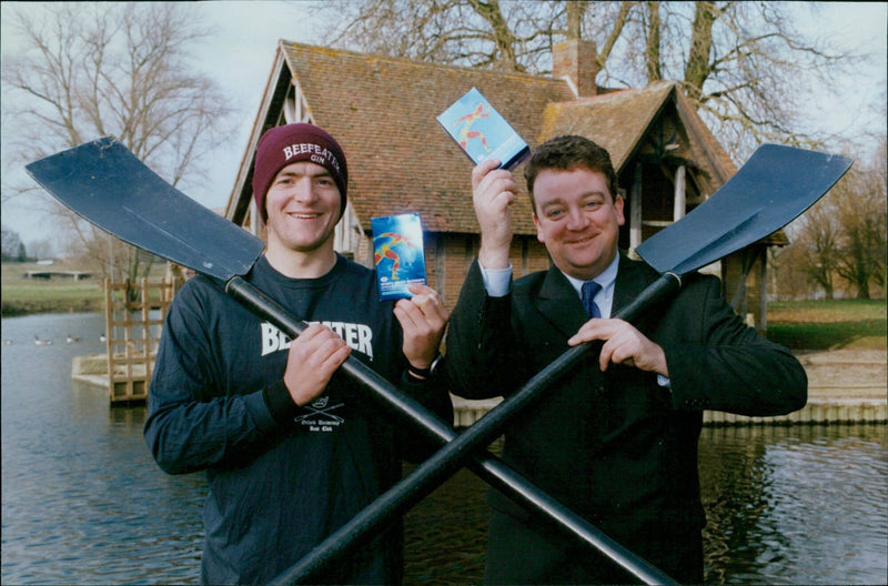 Oxford University Boat Race crew members get vitamins from Boots store. - Vintage Photograph