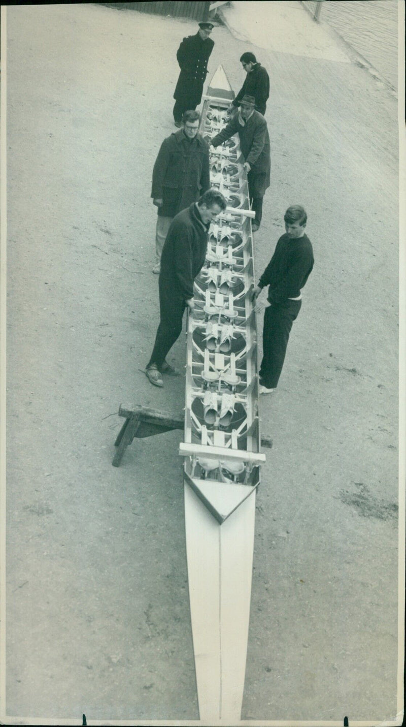 Members of Oxford University Boat Club carry their boat to the boathouse. - Vintage Photograph