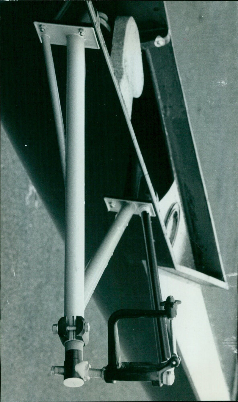 A new boat is launched in the harbor on a sunny day. - Vintage Photograph