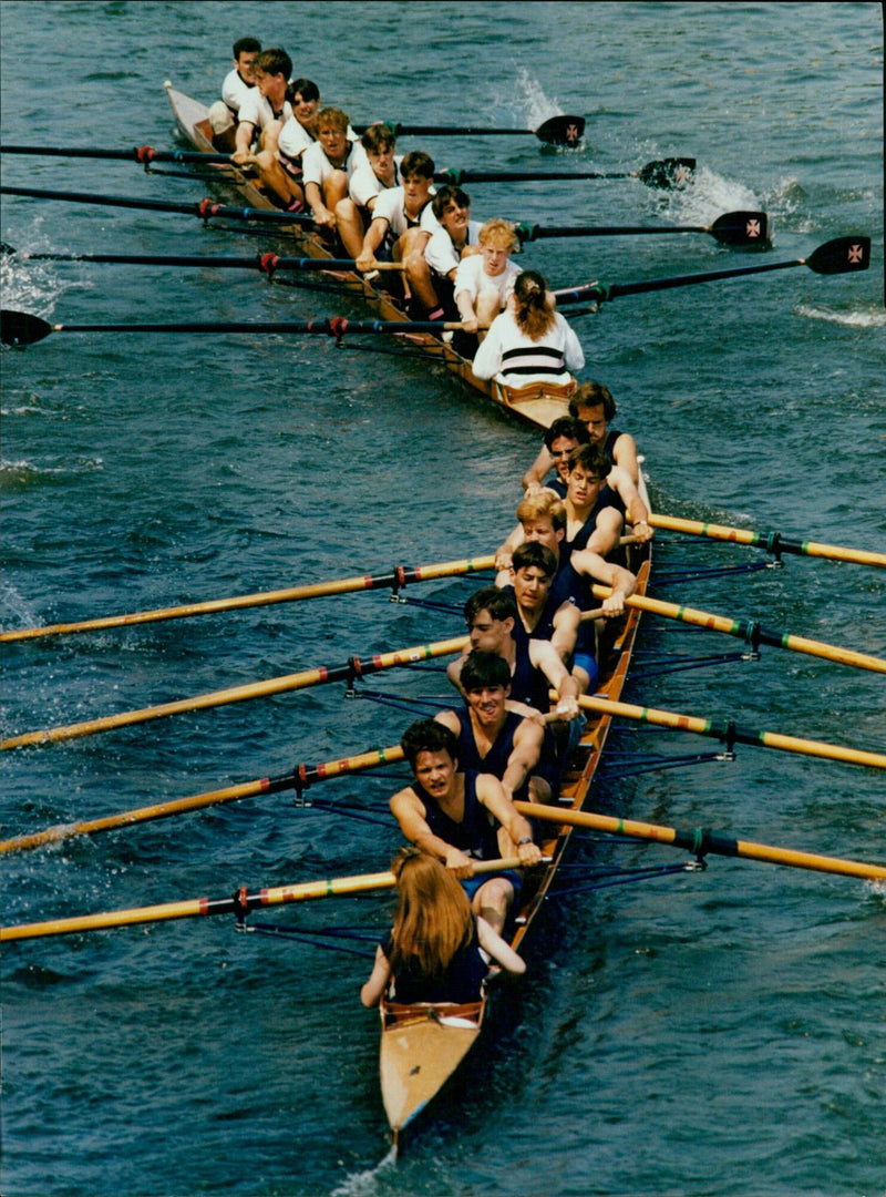 Rowers compete in a race on the River Thames near St. John's College, Oxford. - Vintage Photograph