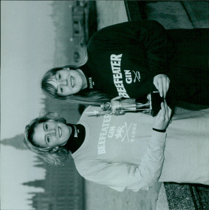 Rowers from Cambridge and Oxford Universities compete in the annual Women's Boat Race. - Vintage Photograph