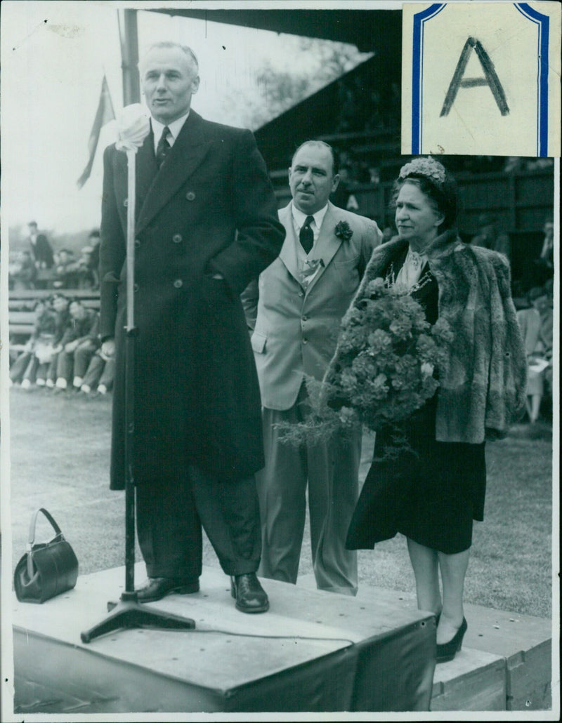 A crowd of people wearing masks gathering at a park in Washington D.C. - Vintage Photograph