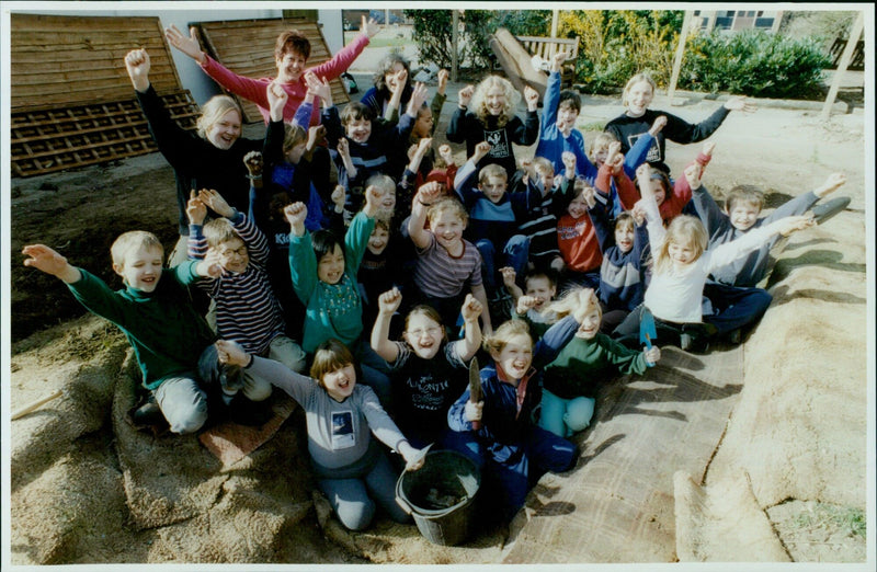 Year 3 students dig for worms in a pond at St. Andrew's School. - Vintage Photograph