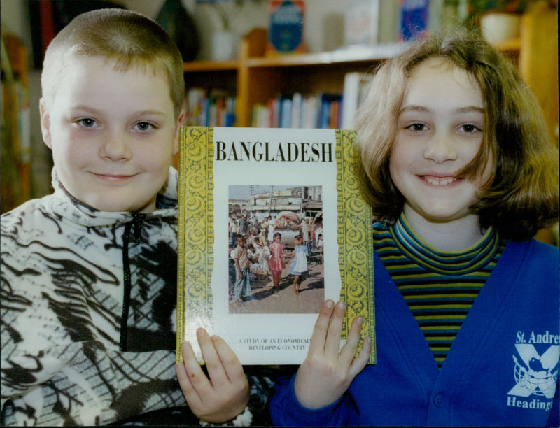 Students Camilla Wilson (8) and Dominic Payne (9) from St. Andrews First School Hearlington, England, collecting money to sponsor a child in Bangladesh. - Vintage Photograph