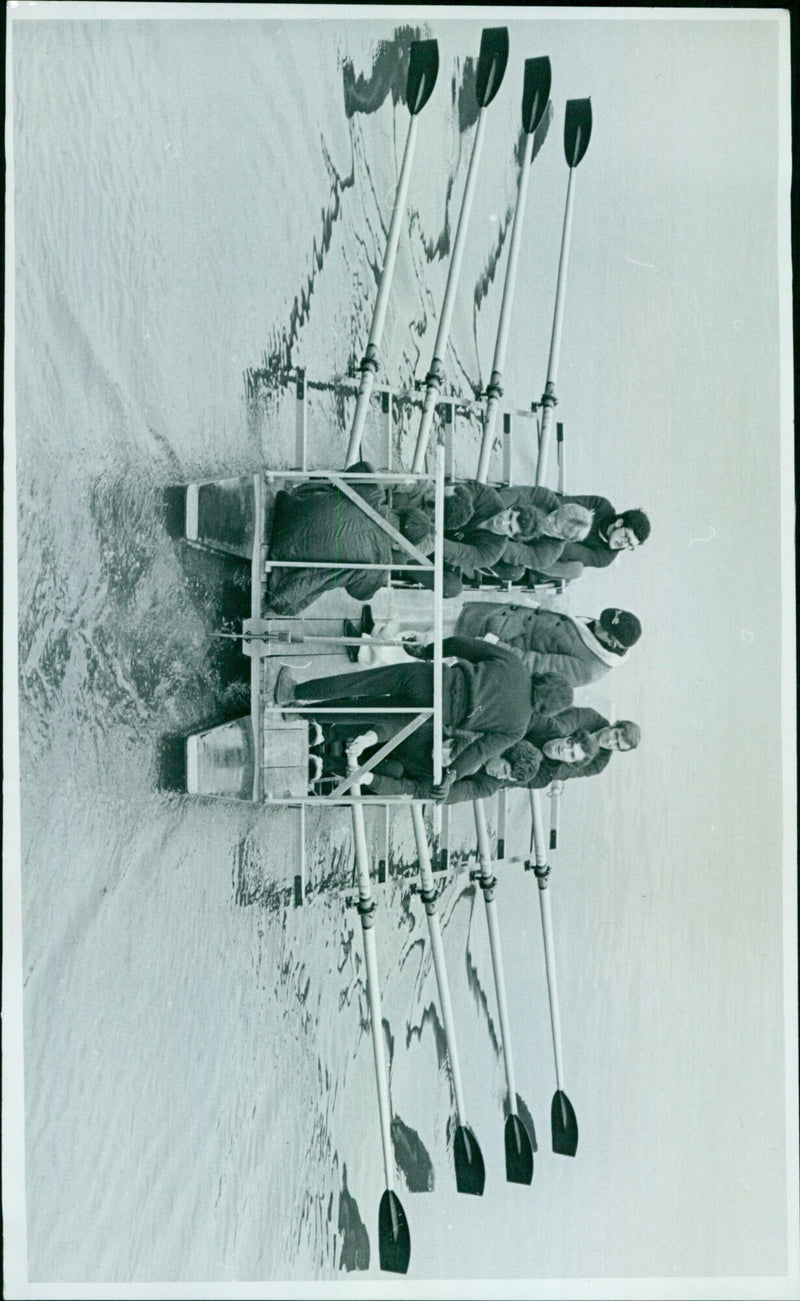 Assistant Coach Peter Reynolds closely examines eight trialists as they pass under Henley Bridge. - Vintage Photograph