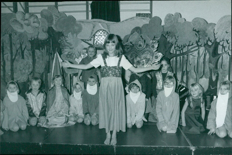 Over 100 students from St Andrew's School, Headington perform Snow White and the Seven Dwarfs on stage. - Vintage Photograph