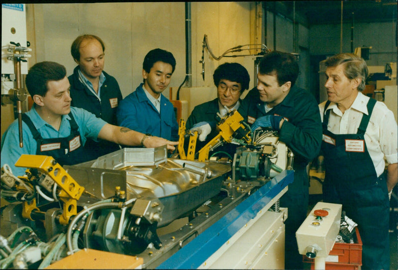 Employees from Oxford Components visit an assembly line in Oxford, England. - Vintage Photograph