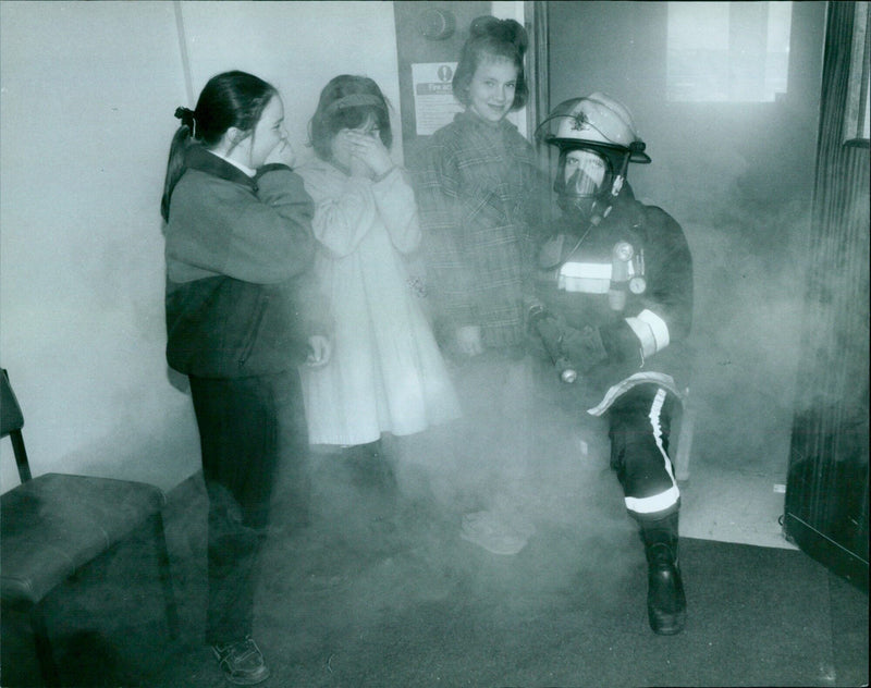 Three students from Bayswater School observe a firefighter on the job at the Rover Car Plant. - Vintage Photograph