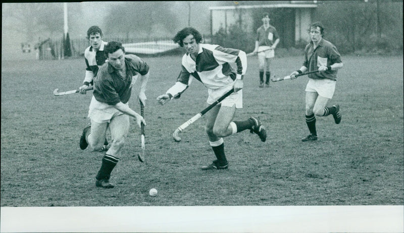 Oxford University H.C. player Ian Sobey challenges Guildford's Chris Basey during a match. - Vintage Photograph