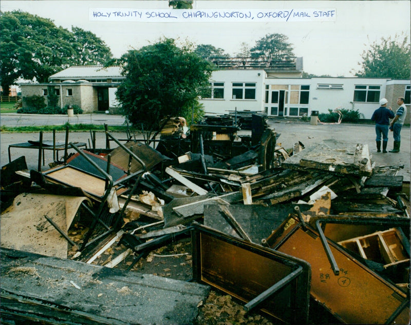 Debris from a fire at Holy Trinity School in Chipping Norton, Oxford is pictured outside. - Vintage Photograph