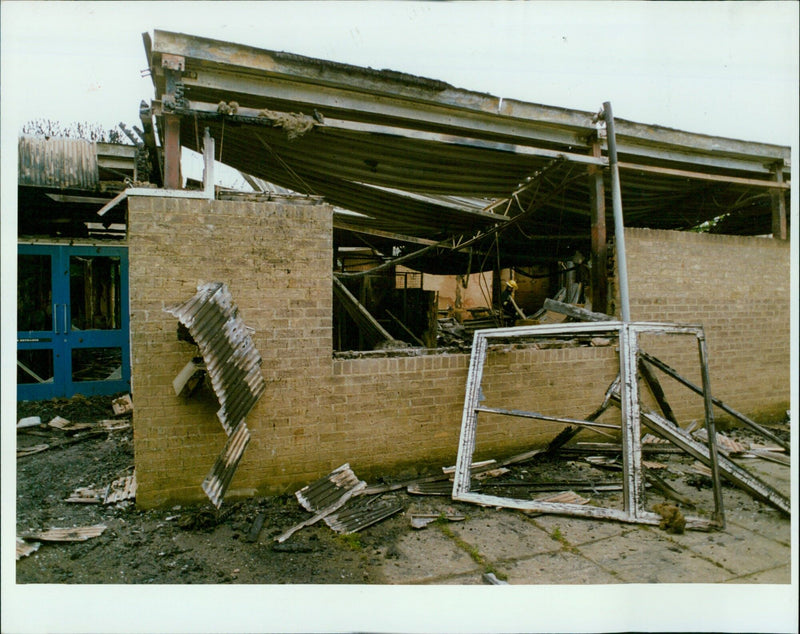 Fire damage at Carterton Community College is seen in this June 19, 1994 photograph. - Vintage Photograph