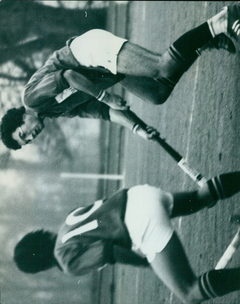 Oxford University's XXXXX J. Bowerman pushes the ball to his skipper, B. Wells during a rugby match against Midlands. - Vintage Photograph