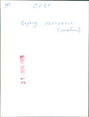 A young woman walking along a street in the city of Cotterell. - Vintage Photograph