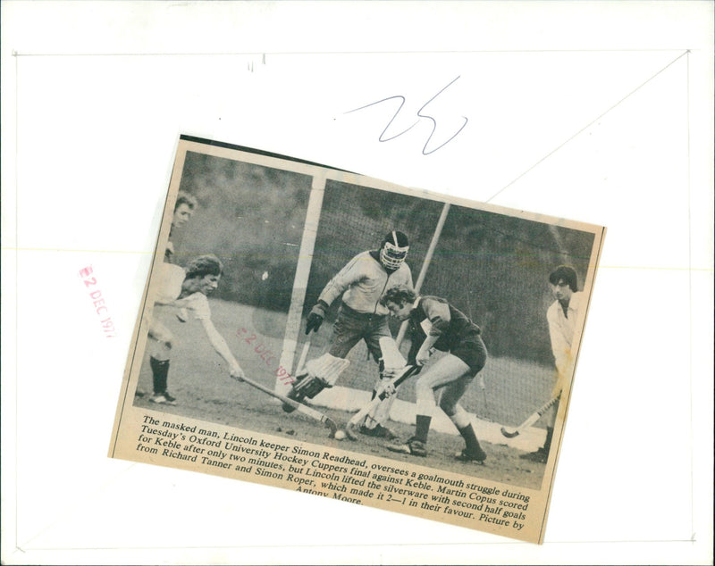 Lincoln keeper Simon Readhead oversees a goalmouth struggle during Oxford University Hockey Cuppers final. - Vintage Photograph