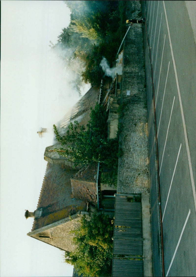 Firefighters battle a blaze at St. Mary's Catholic School on August 13, 1992. - Vintage Photograph