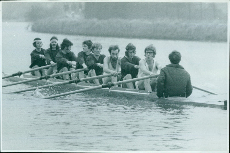 Pembroke College Number One Crew practicing for the upcoming Toppids rowing race on the River Thames. - Vintage Photograph