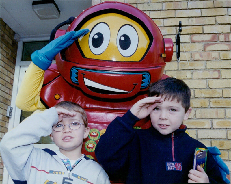 Two students receiving prizes from Micro the robot at Oxford St Aloysius School. - Vintage Photograph