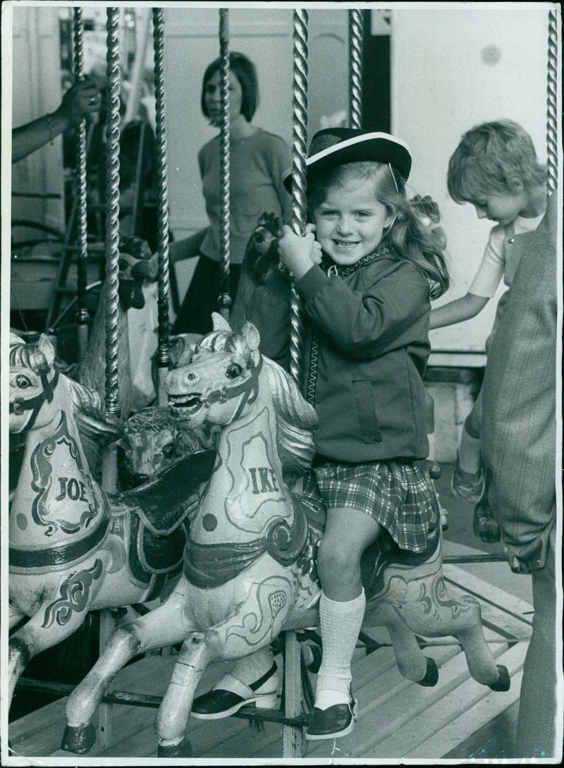 People enjoying the annual St Giles Fair in Oxford, England on September 3, 1973. - Vintage Photograph