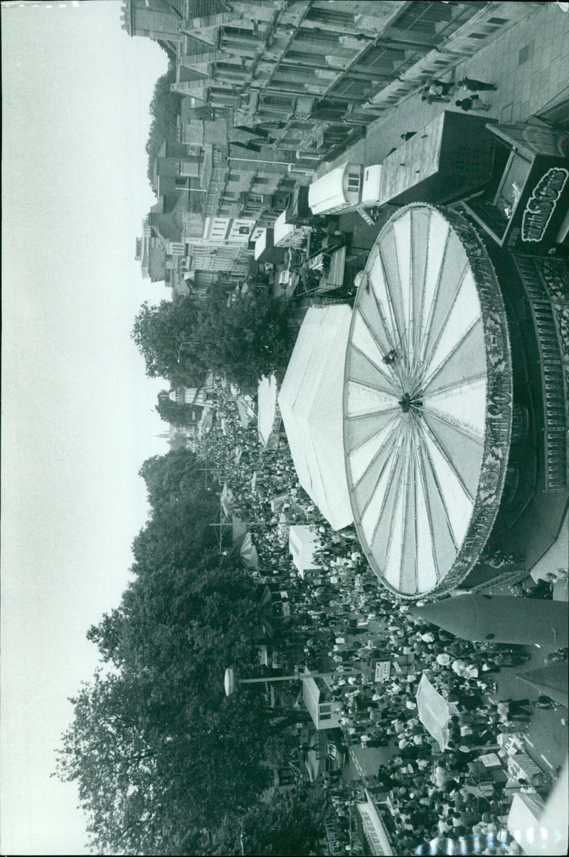 People enjoying the St Giles Fair in Oxford on September 13, 1978. - Vintage Photograph