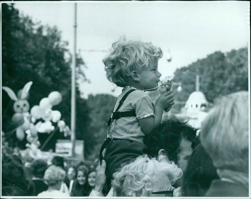 22-month-old Hugh Whitaker of Kidlington enjoys the view of St Giles Fair from his father's shoulders. - Vintage Photograph