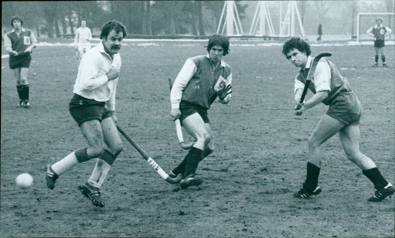 University of Virginia's David Wescott (right) takes evasive action as he makes a shot during a match against United Hospitals. - Vintage Photograph