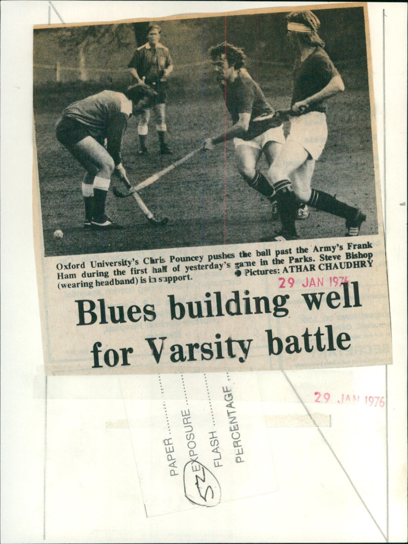 Oxford University's Chris Pouncey pushes the ball past the Army's Frank Ham during a game. - Vintage Photograph