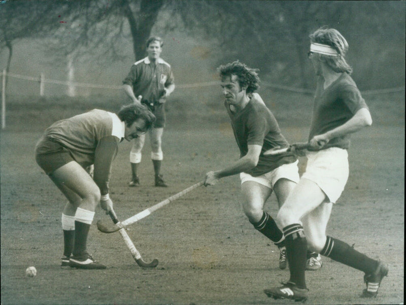 Oxford University's Chris Pouncey pushes the ball past the Army's Frank Ham during a game. - Vintage Photograph